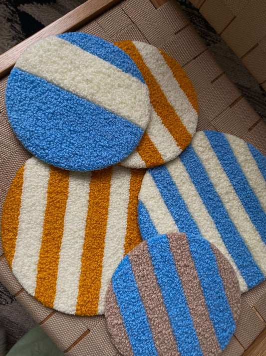 Flere Cirkel Vægtæpper i forskellige farver og størrelser.