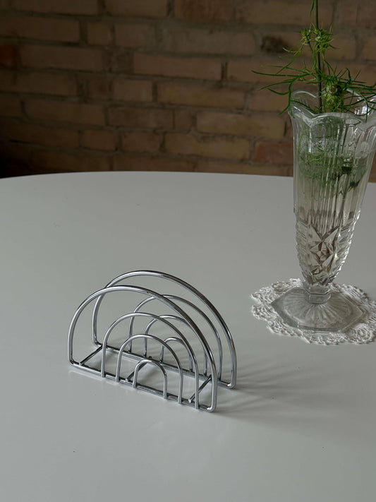 Servietholder i sølvfarvet metal