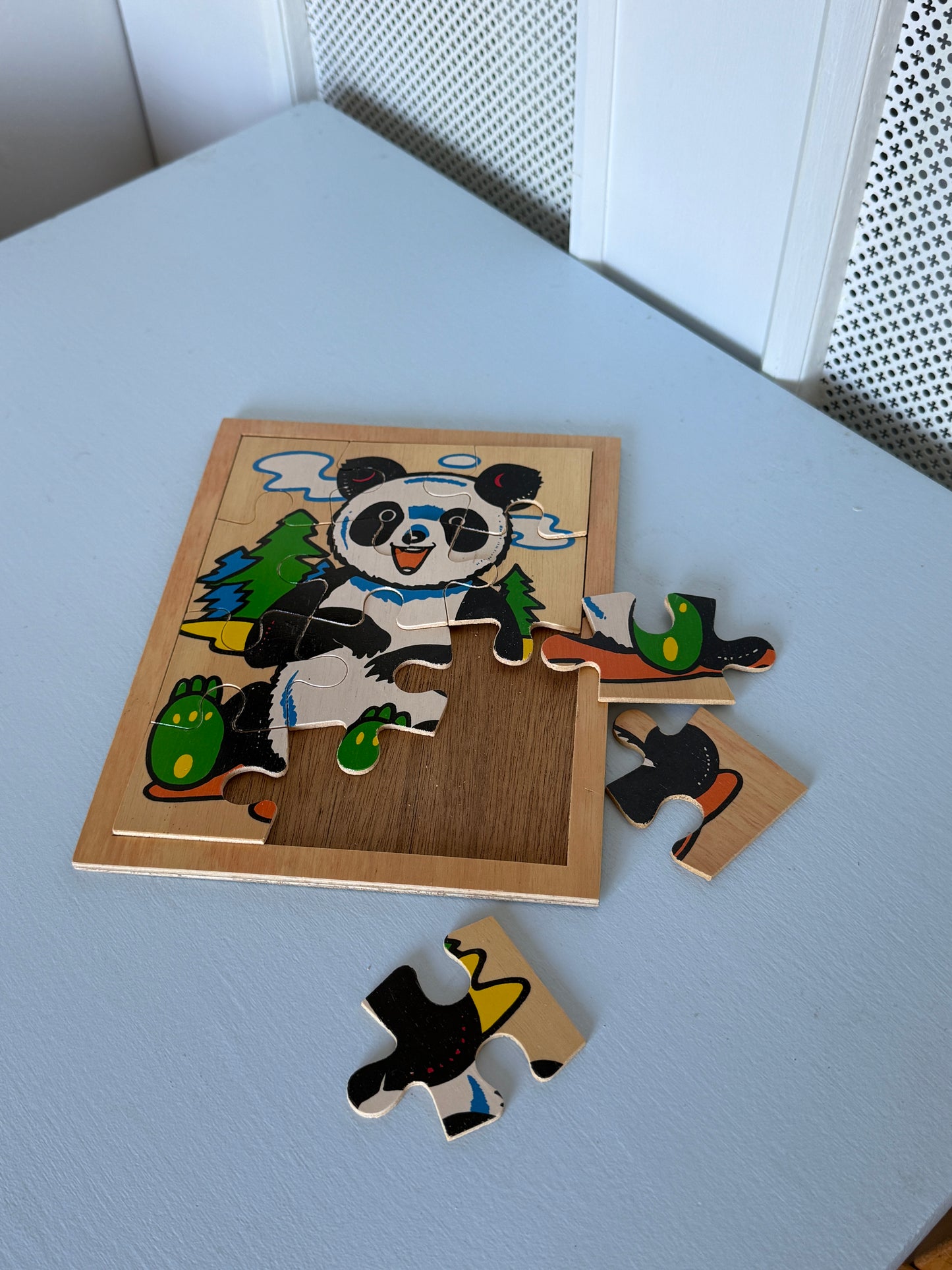 Træpuslespil med panda