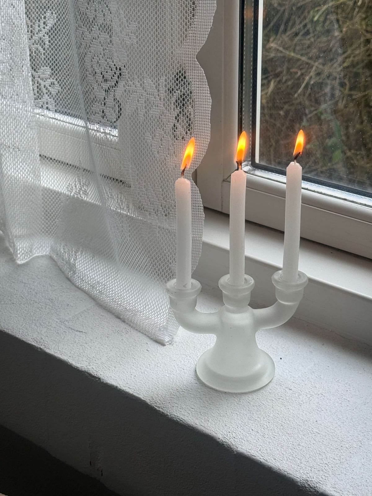 Lysestage i matteret glas
